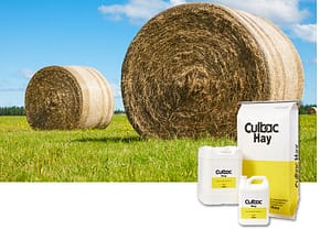 Round Hay Bales in Field with Culbac Hay Product Line Inset